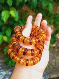 Vòng tay hổ phách hoa bánh xe tự nhiên